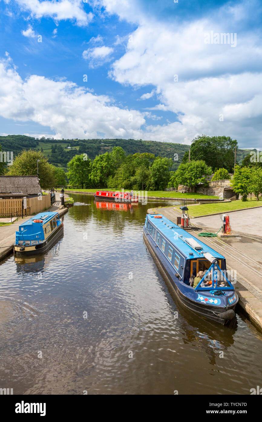 Colourful holiday narrowboats in Trevor Basin on the Llangollen Canal, Clwyd, Wales, UK Stock Photo