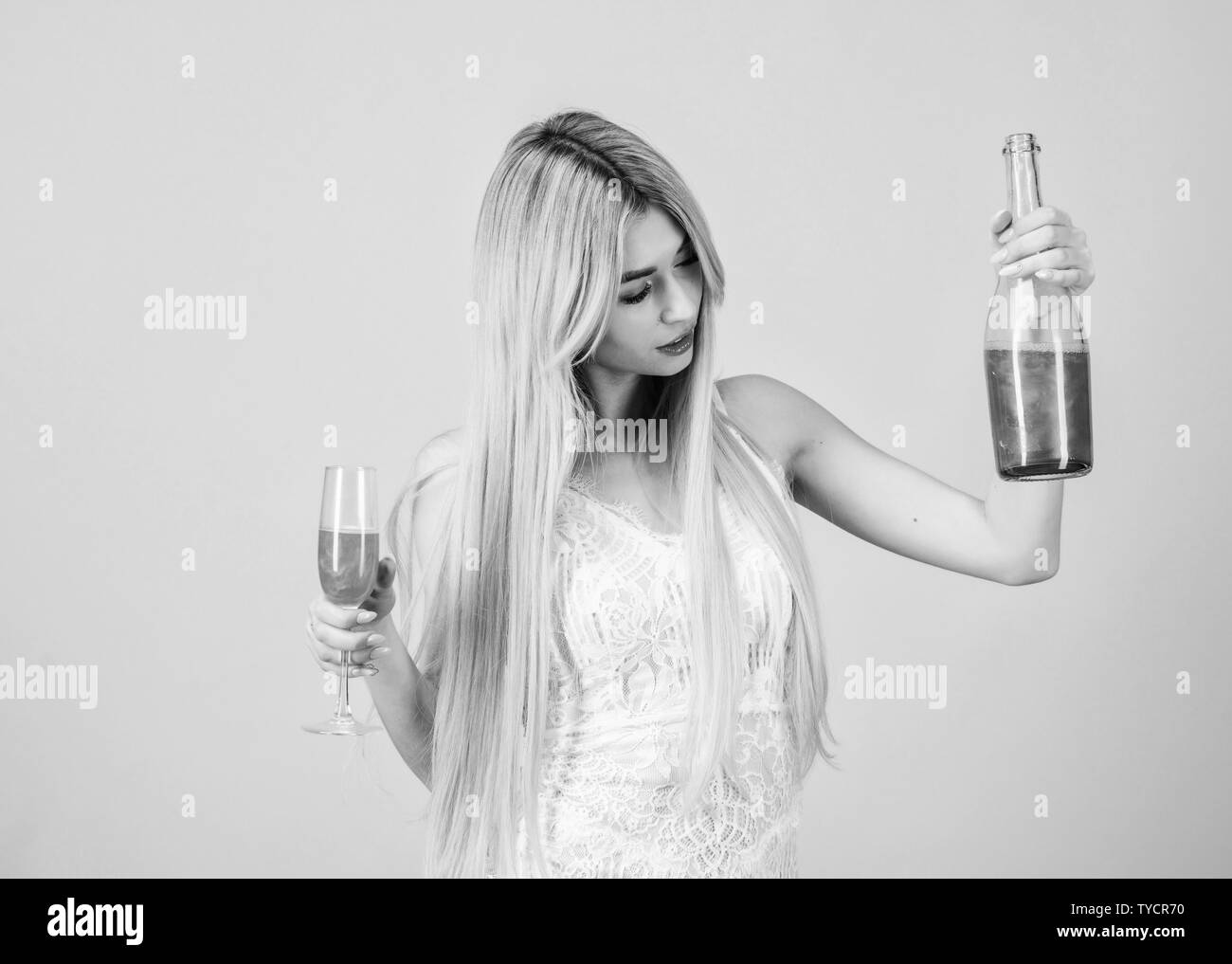 Glamorous party. Girl drinking pearl glitter champagne. Woman white