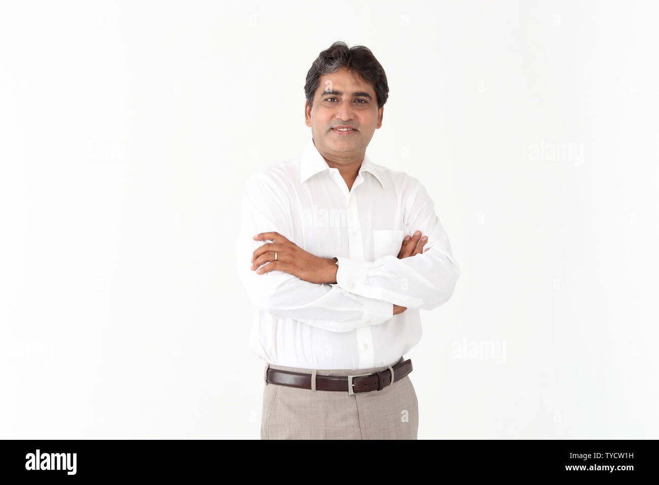 Portrait of a businessman with his arms crossed Stock Photo - Alamy