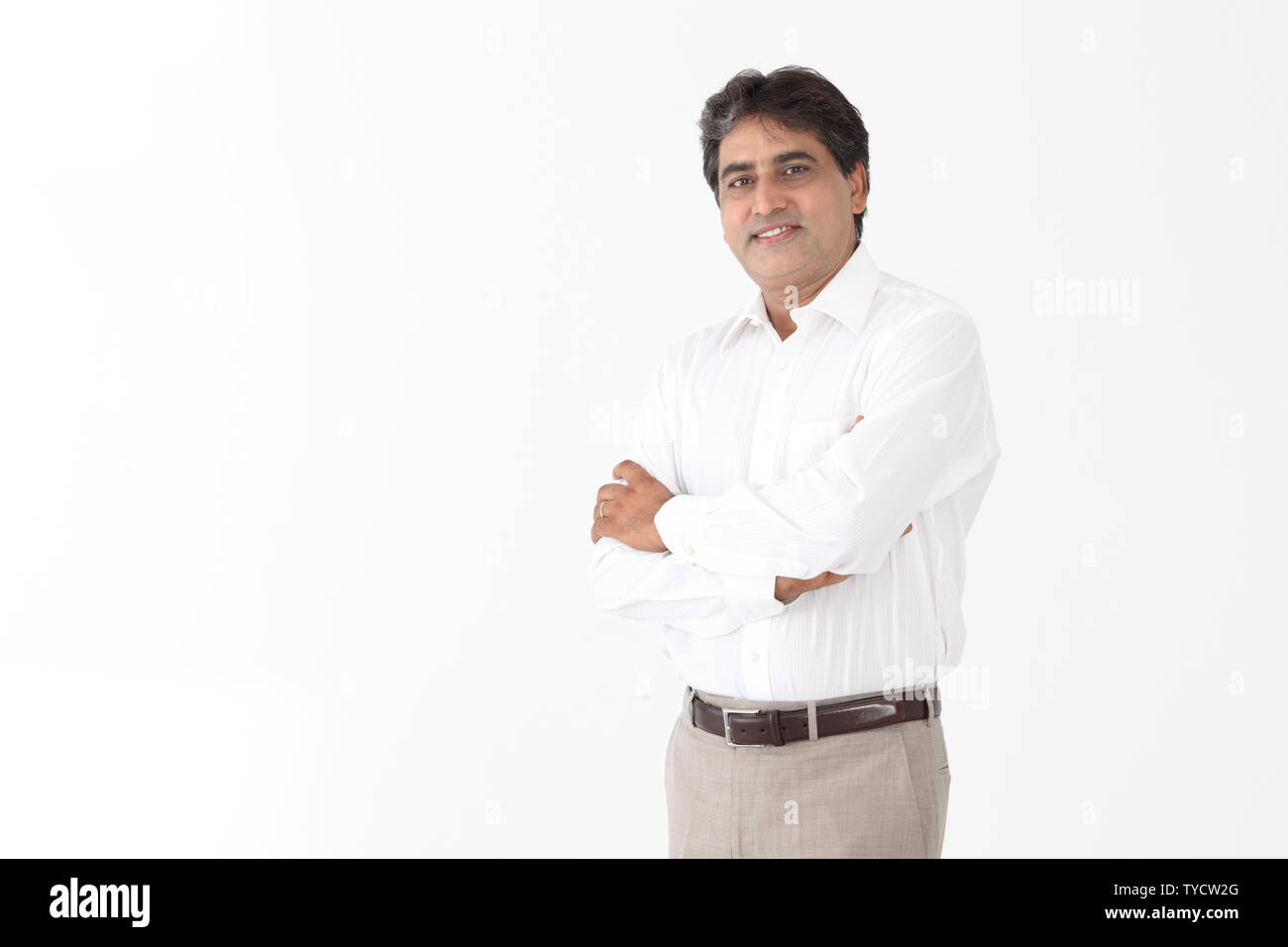 Portrait of a businessman with his arms crossed Stock Photo - Alamy