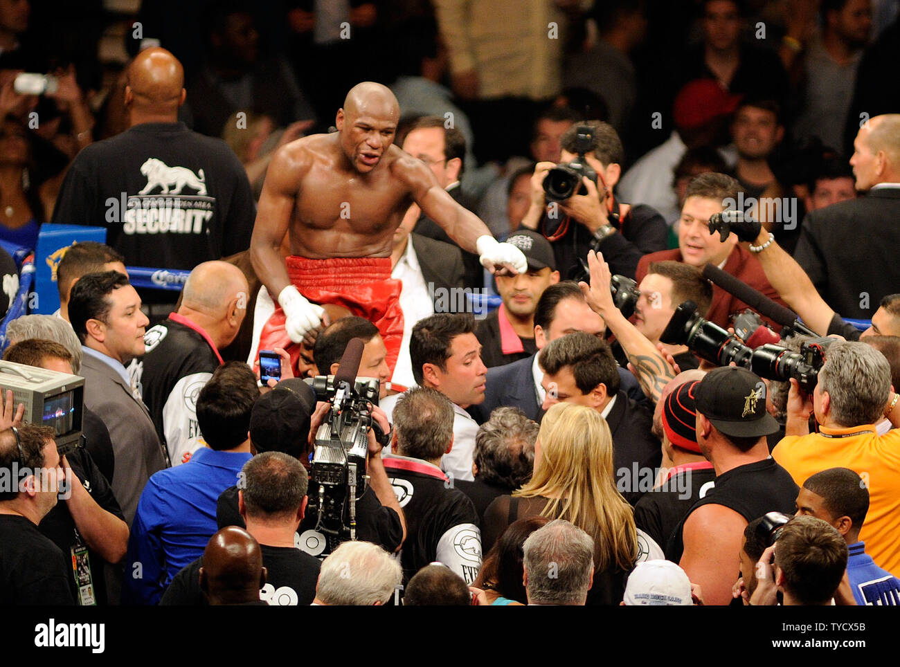 Floyd Mayweather Jr. celebrates after defeating Miguel Cotto by unanimous decision during their WBA super welterweight title fight at the MGM Grand Garden Arena in Las Vegas, Nevada on May 5, 2012.   UPI/David Becker Stock Photo