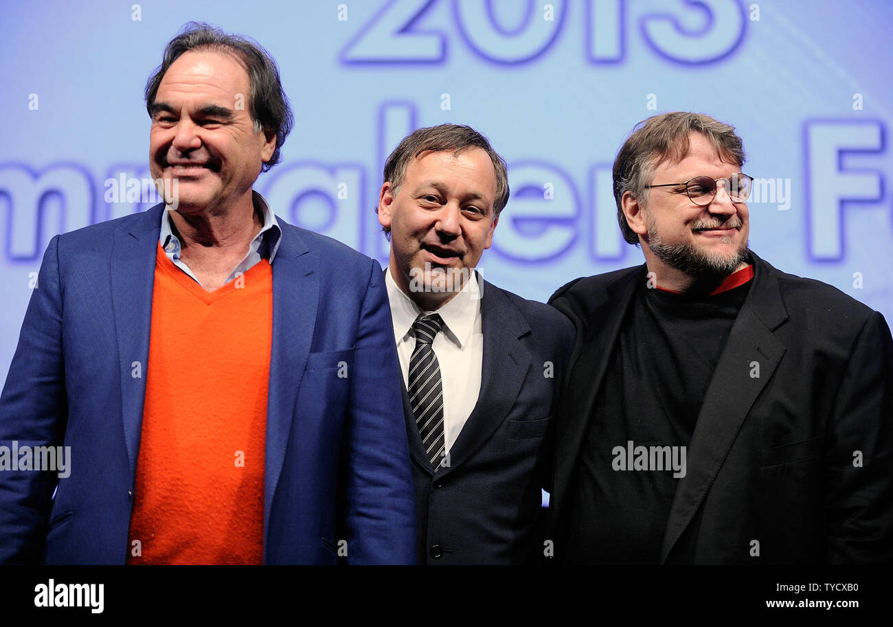 (L-R) Directors Oliver Stone, Sam Raimi and Guillermo del Toro pose after speaking at a filmmakers' roundtable at Caesars Palace during CinemaCon, the official convention of the National Association of Theatre Owners in Las Vegas, Nevada on April 17, 2013. UPI/David Becker Stock Photo
