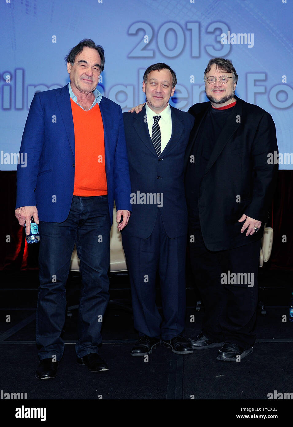 (L-R) Directors Oliver Stone, Sam Raimi and Guillermo del Toro pose after speaking at a filmmakers' roundtable at Caesars Palace during CinemaCon, the official convention of the National Association of Theatre Owners in Las Vegas, Nevada on April 17, 2013. UPI/David Becker Stock Photo