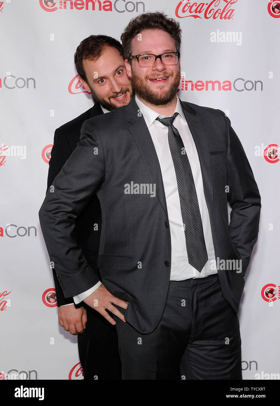 Comedy Filmmakers of the Year award winners Evan Goldberg (L) and Seth Rogen arrive at the CinemaCon awards ceremony at the Pure Nightclub at Caesars Palace during CinemaCon, the official convention of the National Association of Theatre Owners in Las Vegas, Nevada onMarch 27, 2014. UPI/David Becker Stock Photo