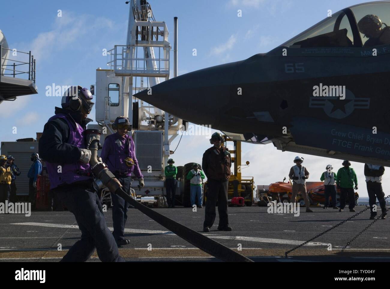 PACIFIC OCEAN (Nov. 1, 2016) Sailors prepare to refuel an F-35B Lightning II aircraft on the flight deck of amphibious assault ship USS America (LHA 6). The F-35B short takeoff/vertical landing (STOVL) variant is the world’s first supersonic STOVL stealth aircraft. America, with Marine Operational Test and Evaluation Squadron 1 (VMX-1), Marine Fighter Attack Squadron 211 (VMFA-211) and Air Test and Evaluation Squadron 23 (VX-23) embarked, are underway conducting operational testing and the third phase of developmental testing for the F-35B Lightning II aircraft, respectively. The tests will ev Stock Photo