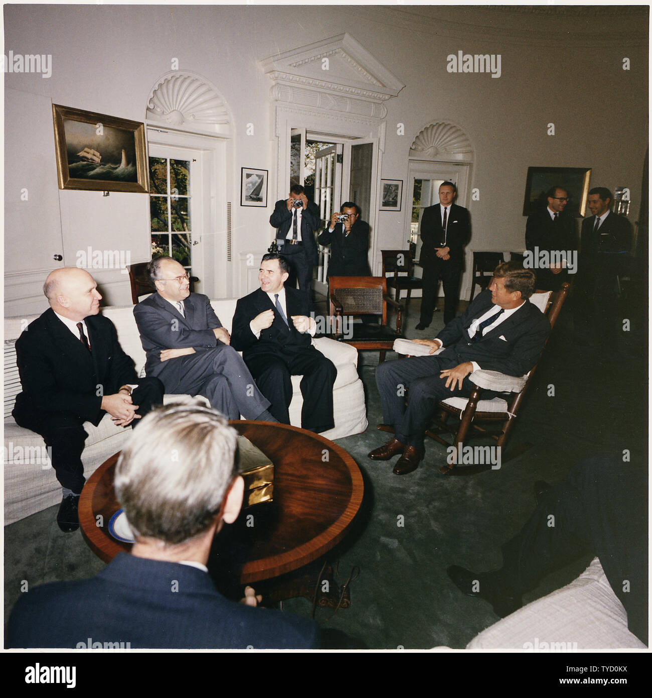 Photograph of President John F. Kennedy's Meeting with the Soviet Ambassador and Ministers at the White House; Scope and content:  Original caption: Meeting with the Soviet Minister of Foreign Affairs, Soviet Deputy Minister Vladimir S. Seyemenov, Ambassador of the USSR Anatoly F. Dobrynin, Soviet Minister of Foreign Affairs Andrel Gromyko, President Kennedy, Photographers, Aides.  White House, Oval Office. Stock Photo