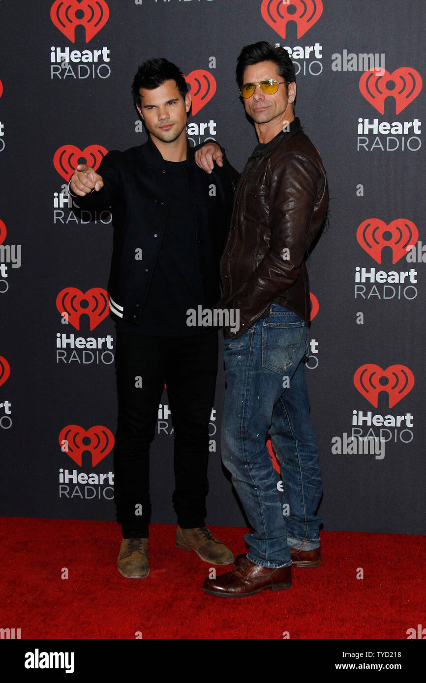 Taylor Lautner and John Stamos arrive for the iHeartRadio Music Festival at the T-Mobile Arena in Las Vegas, Nevada on September 24, 2016.  Photo by James Atoa/UPI Stock Photo