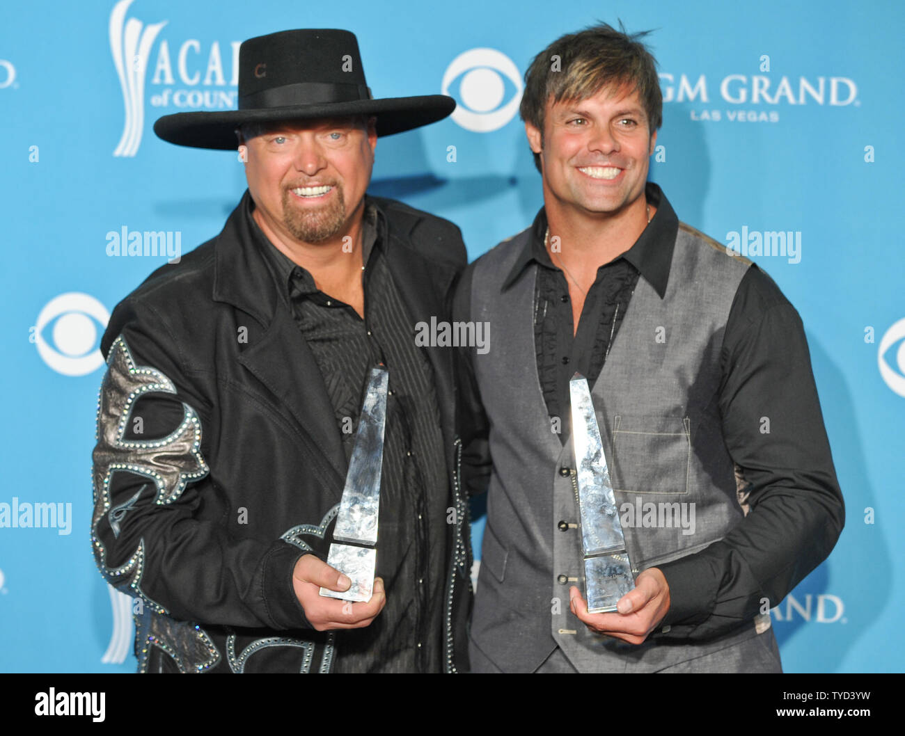 Kix Brooks (R) and Ronnie Dunn, of the duo Brooks and Dunn, arrive in the photo room at the