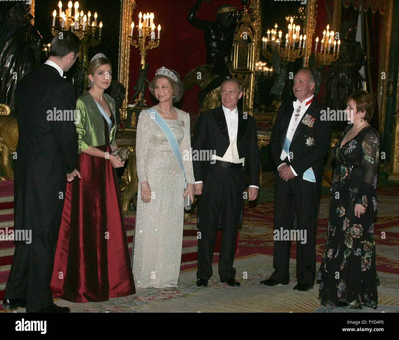 From left to right: Spanish Prince Inaki Urdangarin, his wife Cristina, Queen Sofia, Russian President Vladimir Putin, King Juan Carlos and Russian first lady Lyudmila Putin pose for a photo before their private dinner at Royal Palace in Madrid, February 8, 2006. Putin is in Spain on a two-day state visit to discuss  international terrorism and Russian cooperation with international organizations to prevent terrorism. (UPI Photo/Anatoli Zhdanov) Stock Photo