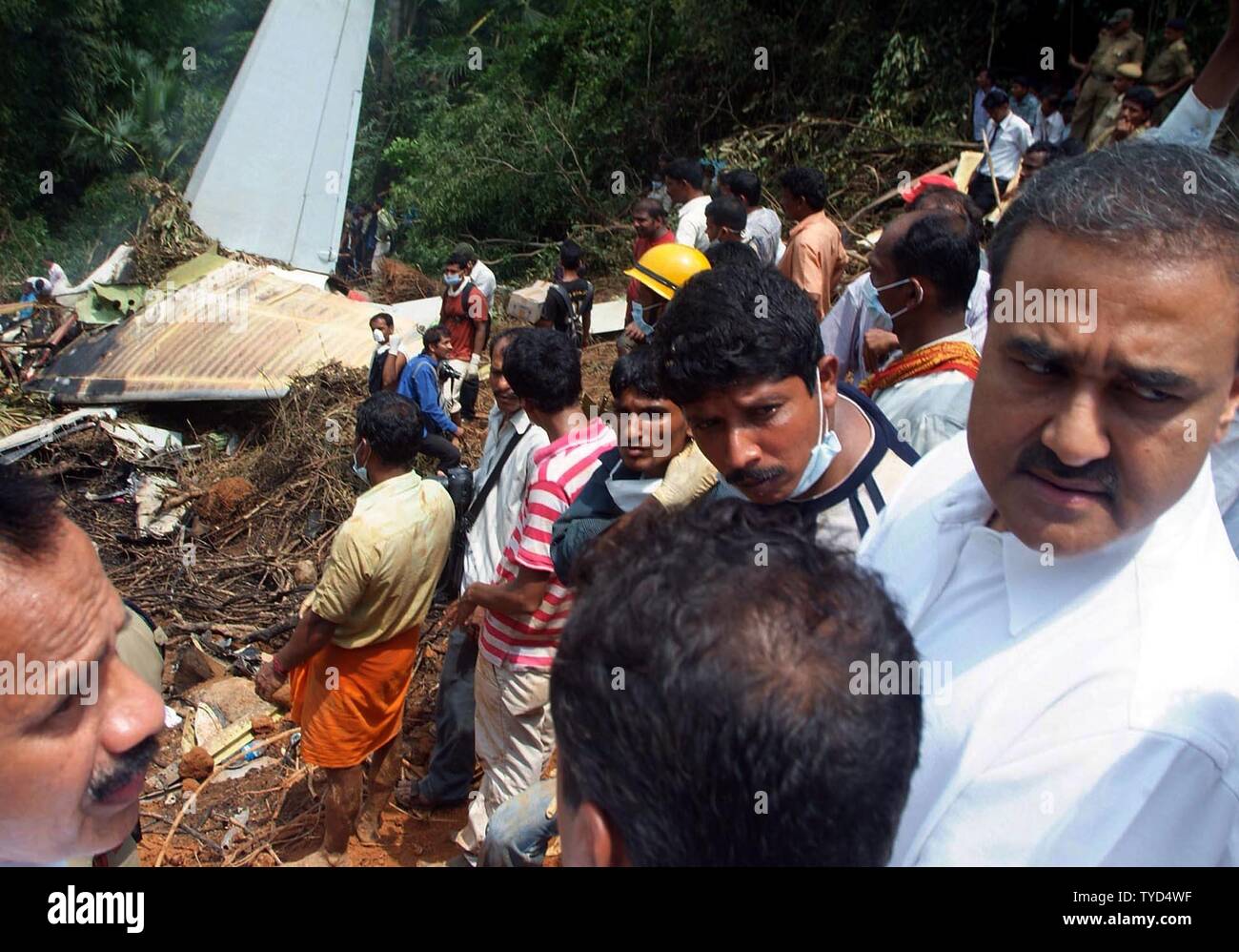 Ambulances and people gather near the site Air India Express plane after it overshot the runway and crashed at Bajpe Airport in Mangalore, India on May 22, 2010. Of the 166 passengers and crew on board the plane, only 8 survived. UPI Stock Photo