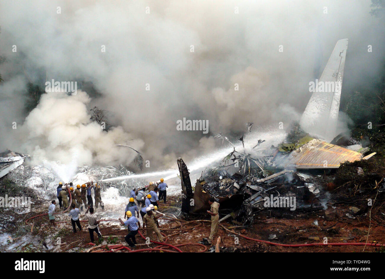 Firefighters douse the Air India Express plane after it overshot the runway and crashed at Bajpe Airport in Mangalore, India on May 22, 2010. Of the 166 passengers and crew on board the plane, only 8 survived. UPI Stock Photo