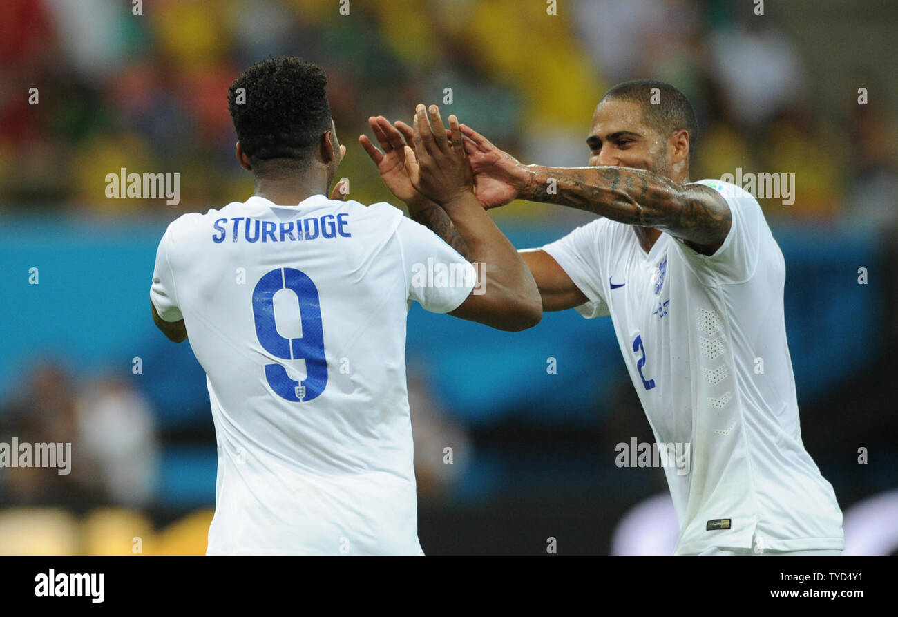 Daniel Sturridge of England is congratulated by team-mate Glen Johnson after scoring the equaliser during the 2014 FIFA World Cup Group D match at the Arena Amazonia in Manaus, Brazil on June 14, 2014. UPI/Chris Brunskill Stock Photo