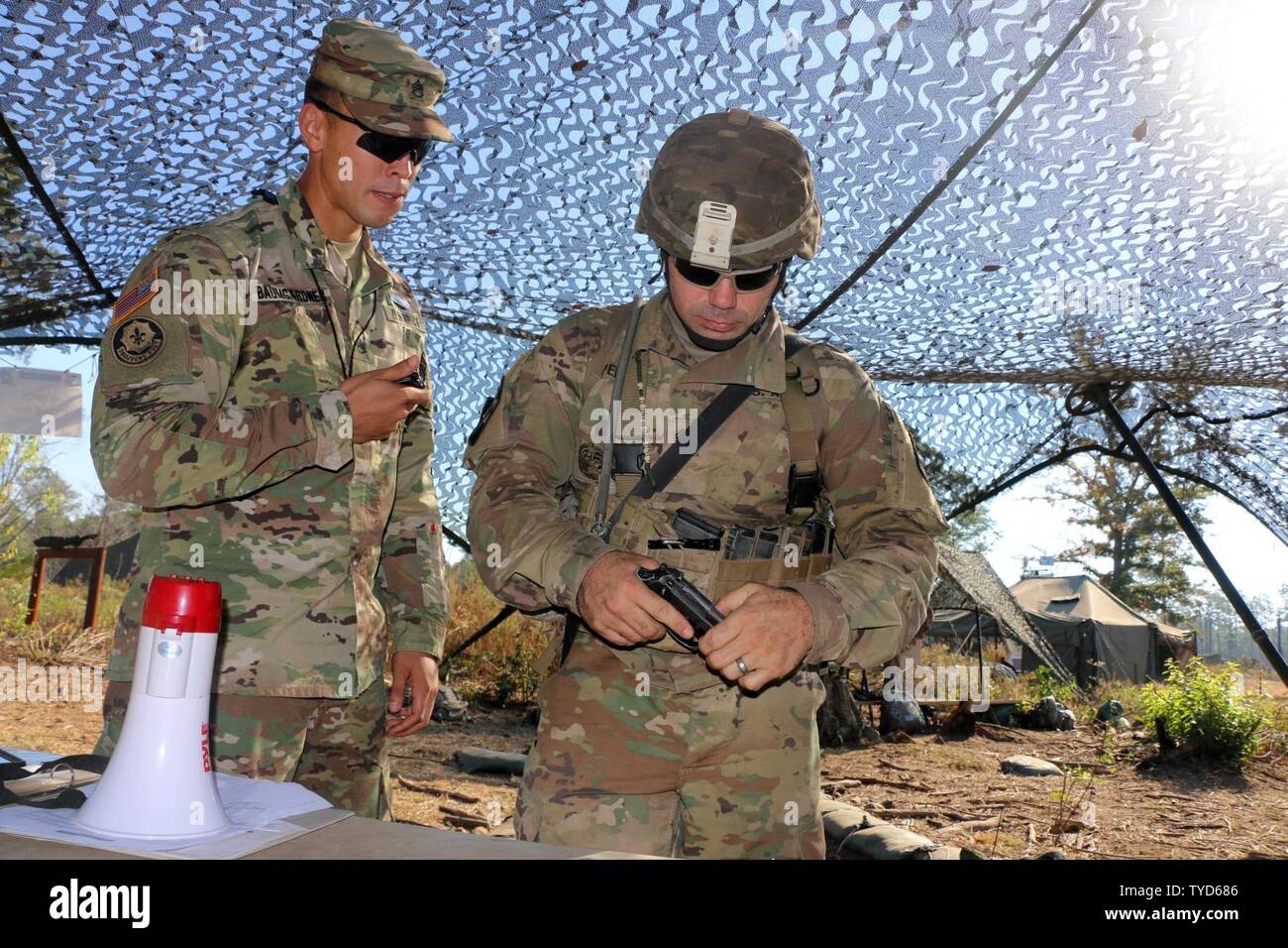 A 3rd Infantry Division Soldier performs a functions check on an M9