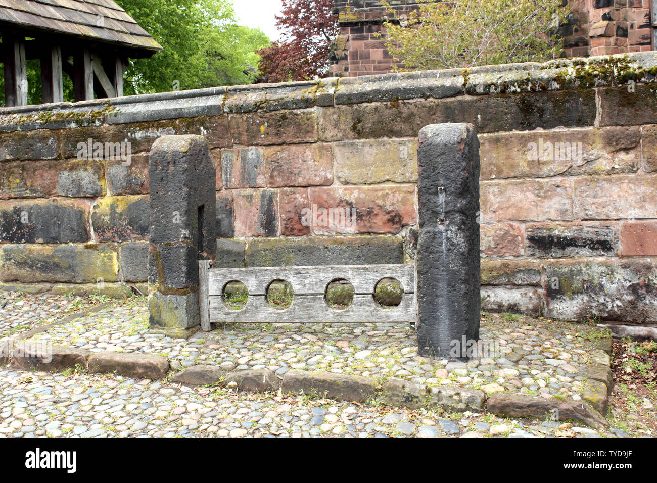 Stocks outside St Mary & All Saints Church Great Budworth Stock Photo