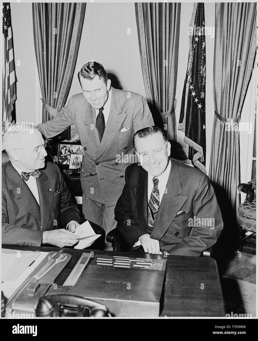 Photograph Of President Truman At His Desk In The Oval