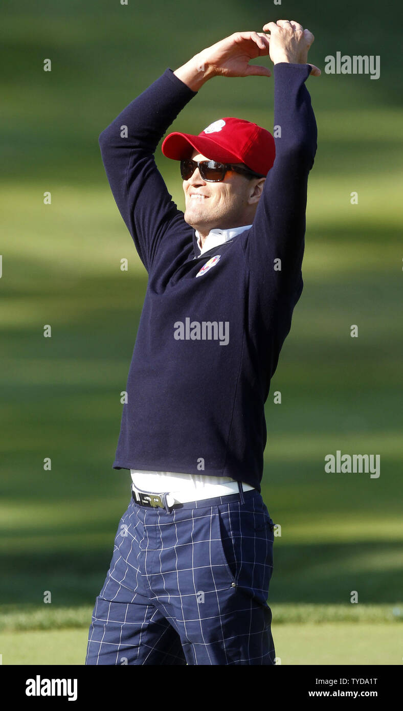 Zach Johnson leads the gallery on the 14th green after USA's Bubba Watson and Webb Simpson defeated Europe's Paul Lawrie and Peter Hanson at the 39th Ryder Cup at Medinah Country Club on September 28, 2012 in Medinah, Illinois.   UPI/Mark Cowan Stock Photo