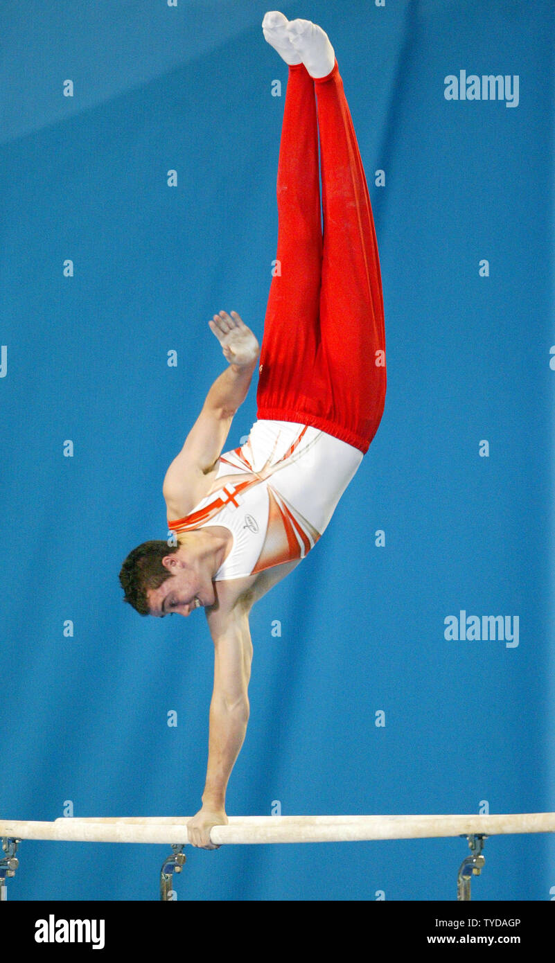 English gymnast Kristian Thomas competes on the parallel bars in the