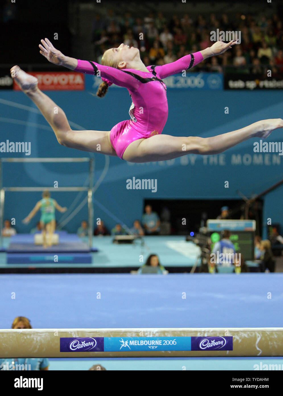 Australian gymnast Hollie Dykes leaps above the balance beam