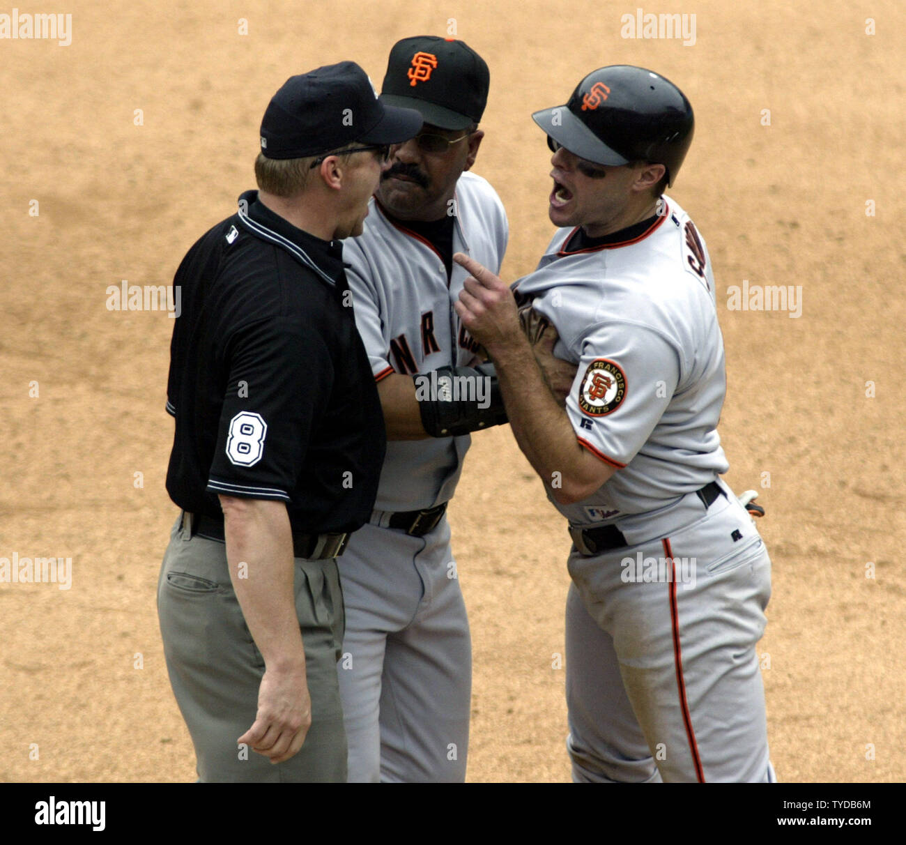 Florida Marlins catcher Ivan Rodriguez tags out San Francisco Giants J.T.  Snow to end the game, Marlins pitcher Ugueth Urbina watches, as the Marlins  beat the Giants at Pro Player Stadium, to