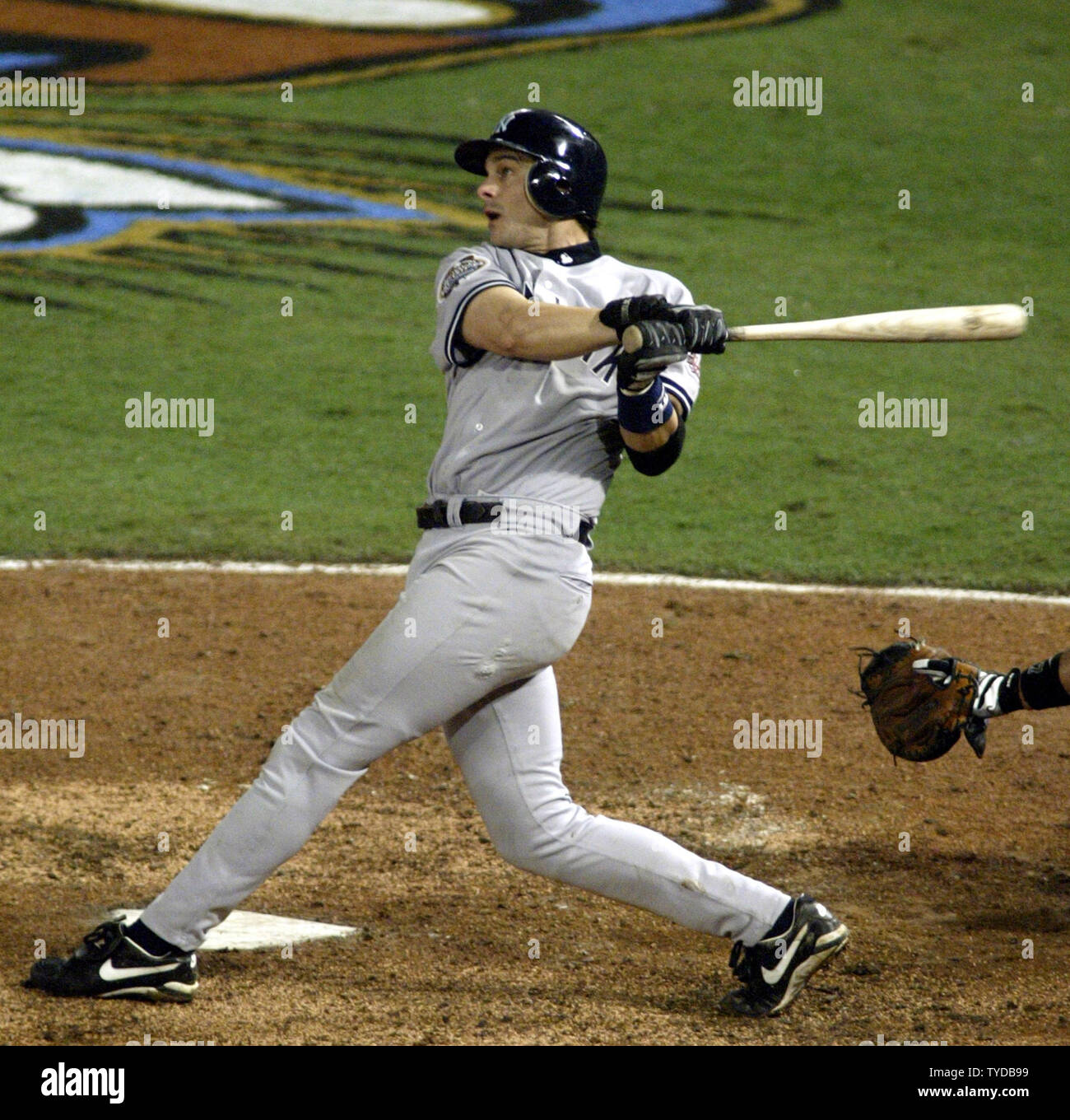 New York Yankees Aaron Boone watches his home run clear the fence en route to a 6-1 victory over the Florida Marlins in game 3 of the 2003 MLB World Series, at Pro Player Stadium, Miami, Florida, October 21, 2003..   (UPI/MICHAEL BUSH) Stock Photo