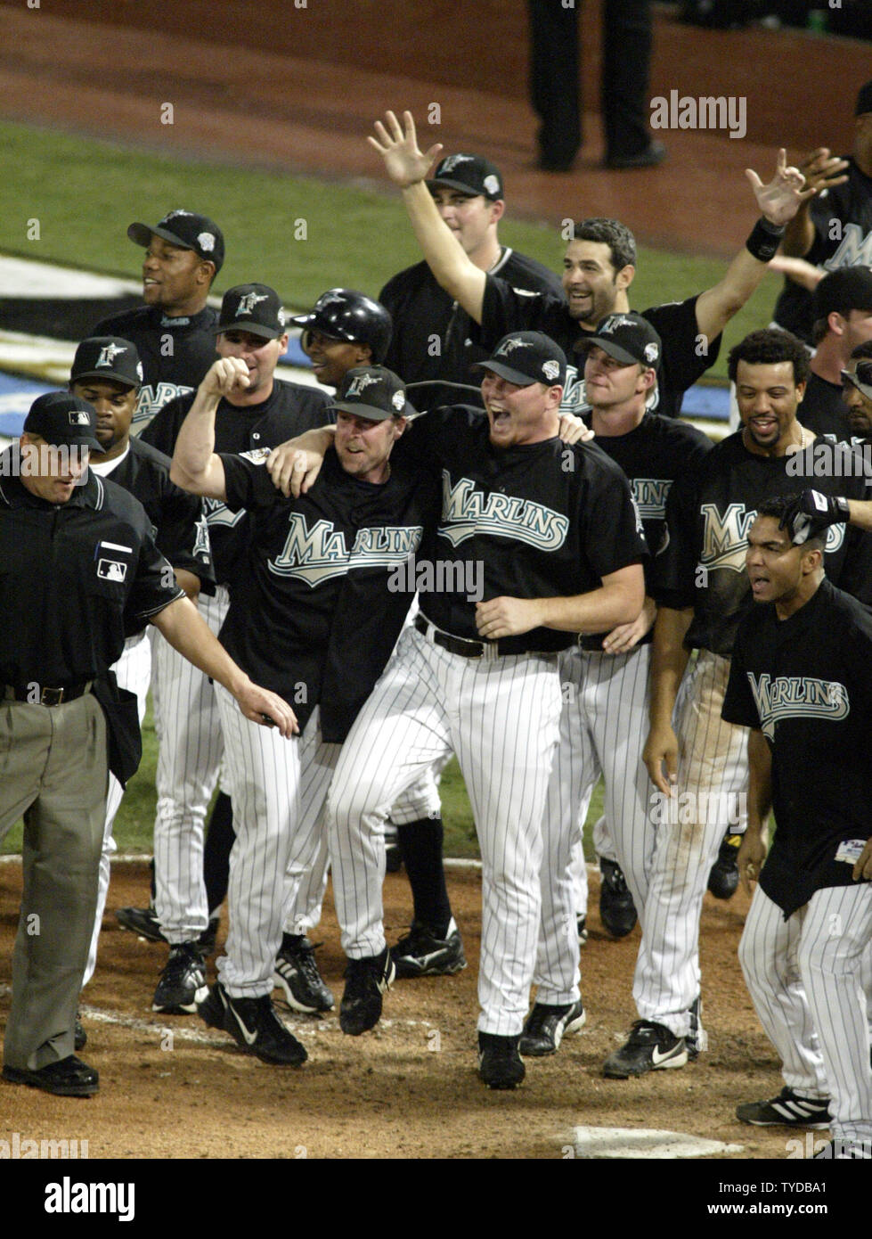 The Florida Marlins celebrate victory,waiting for Alex Gonzalez to