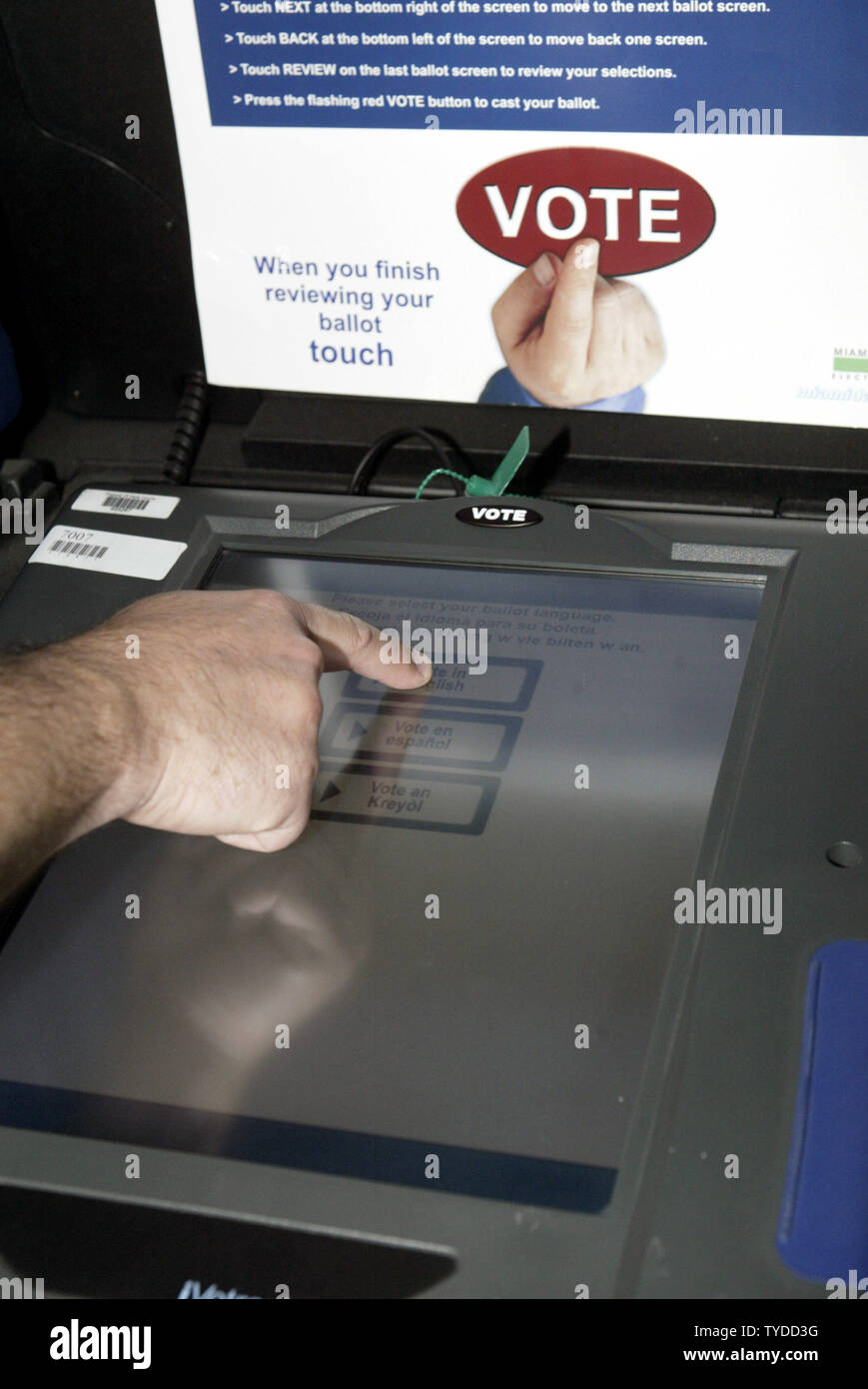An voter makes his choices in the 2004 general election, using the new