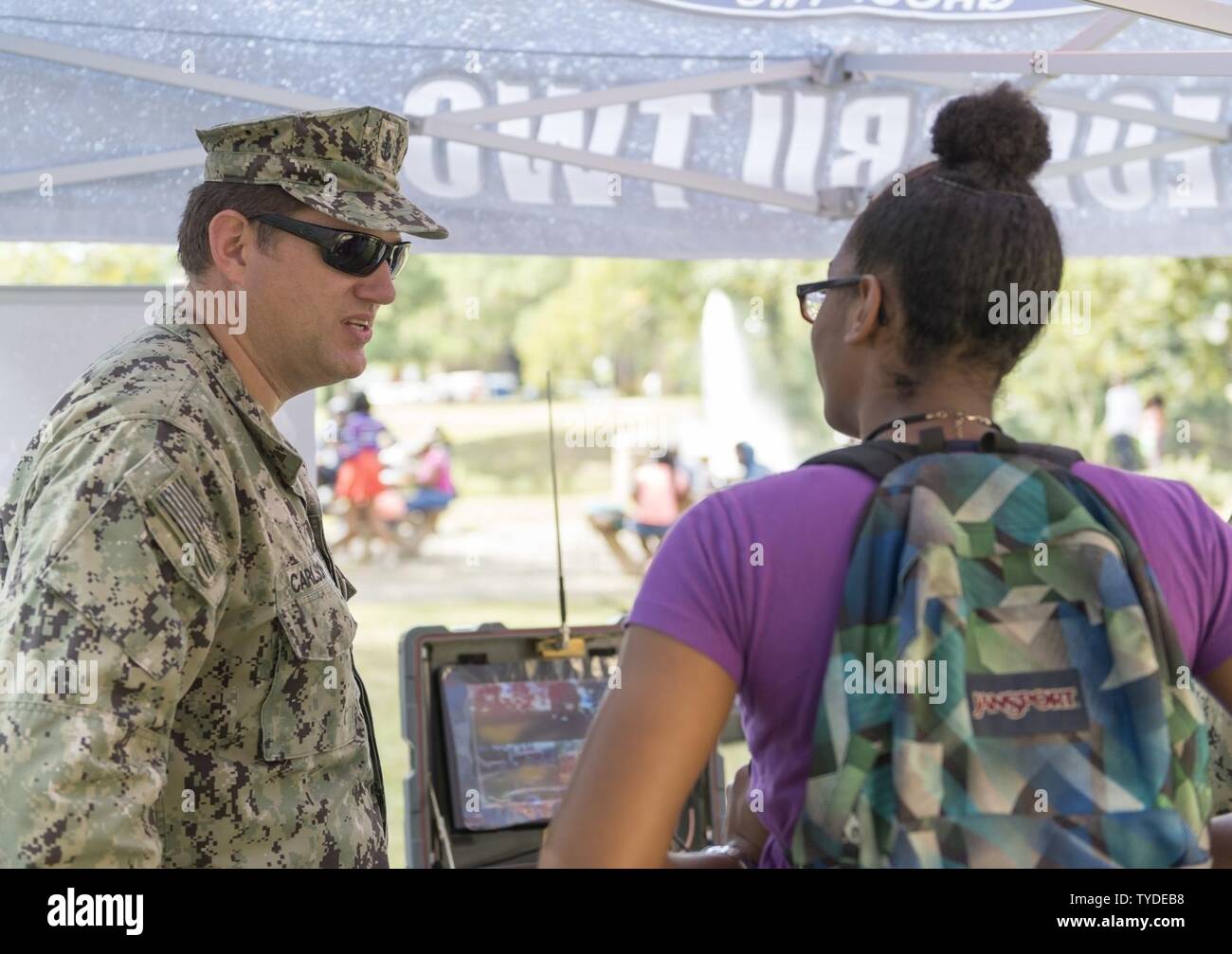 BATON ROUGE, La. (Nov. 2, 2016) Senior Chief Petty Officer Steve Carlson, assigned to Explosive Ordnance Disposal Group (EODGRU) 2, explains the mission of Navy EOD to a student during a visit to Southern University and A&M College as part of Baton Rouge Navy Week 2016. Baton Rouge is one of select cities to host the 2016 Navy Week, a week dedicated to raising U.S. Navy awareness through local outreach, community service and exhibitions. Stock Photo