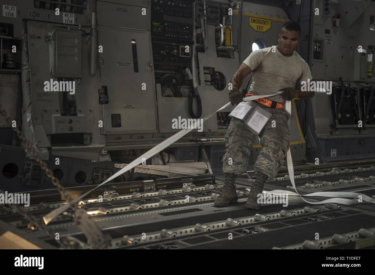 Senior Airman Zephaniah Valdez, 8th Expeditionary Air Mobility Squadron ramp transportation journeyman, pulls a pallet into an 816th Expeditionary Airlift Squadron C-17 Globemaster III in support of Operation Freedom’s Sentinel Nov. 3, 2016. The operation focuses on training, advising, and assisting the Afghan Security Institutions and Afghan National Defense and Security Forces in order to build their capabilities and long-term sustainability. Stock Photo