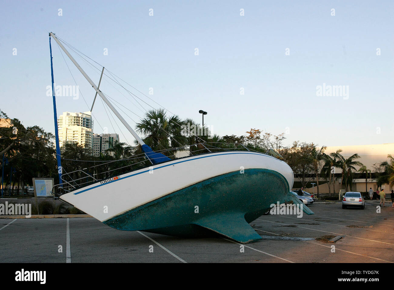 A sail boat lies in the Dinner Key Marina parking lot, lifted out of Biscayne Bay by category 3 Hurricane Wilma in Coconut Grove, Florida on October 25, 2005.  (UPI Photo/Michael Bush) Stock Photo