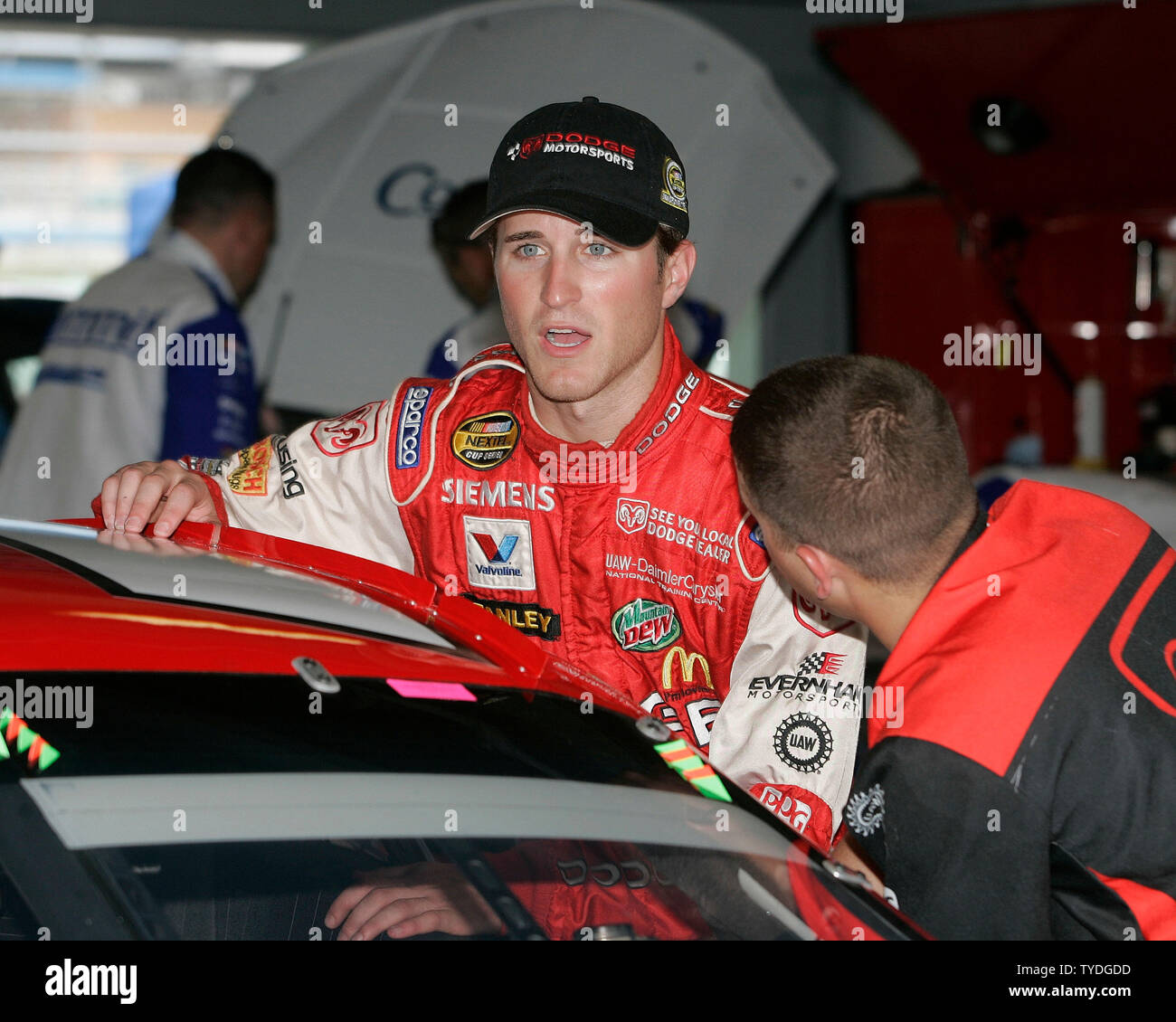 NASCAR Nextel Cup driver Kasey Kahne climbs into his car for the beginning of practice, in the garage area at the Homestead-Miami Speedway, in Homestead,  Florida on November 18, 2005.  (UPI Photo/Michael Bush) Stock Photo