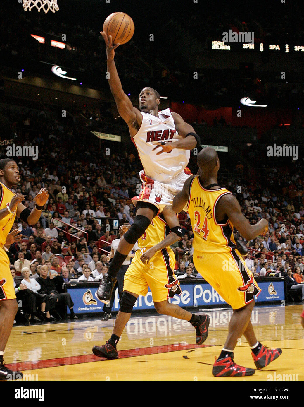 Miami Heats Dwyane Wade drives to the basket over Atlanta Hawk Marvin Williams in first half action, at the American Airlines Arena, in Miami,  Florida, on December 20, 2005.  (UPI Photo/Michael Bush) Stock Photo