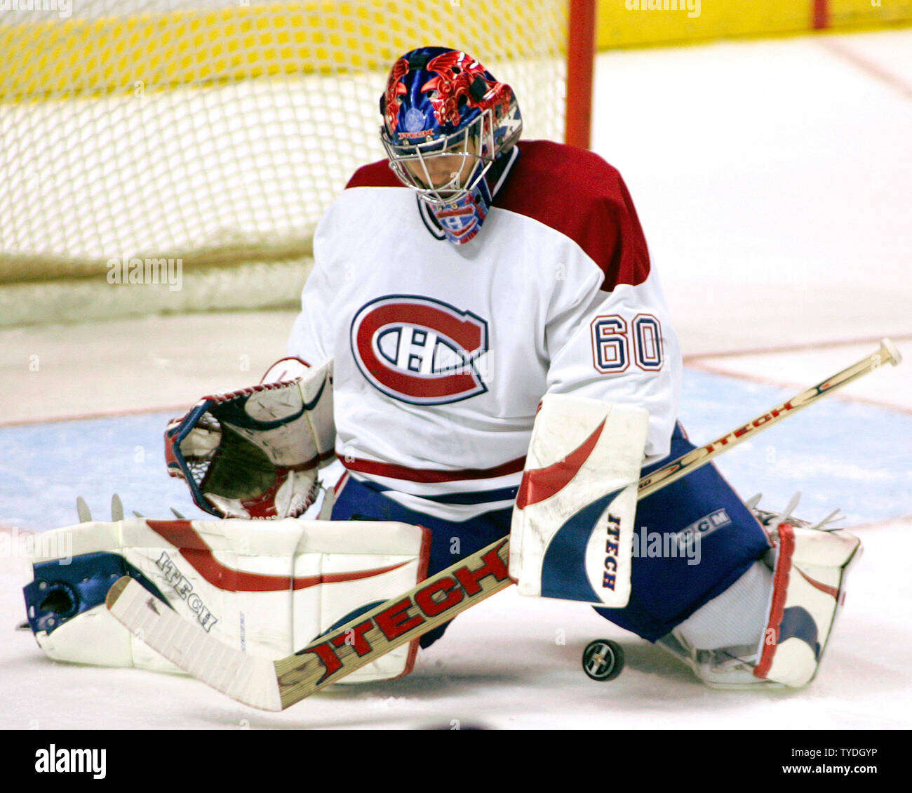 Montreal Canadiens goalie Jose Theodore makes a save against the ...