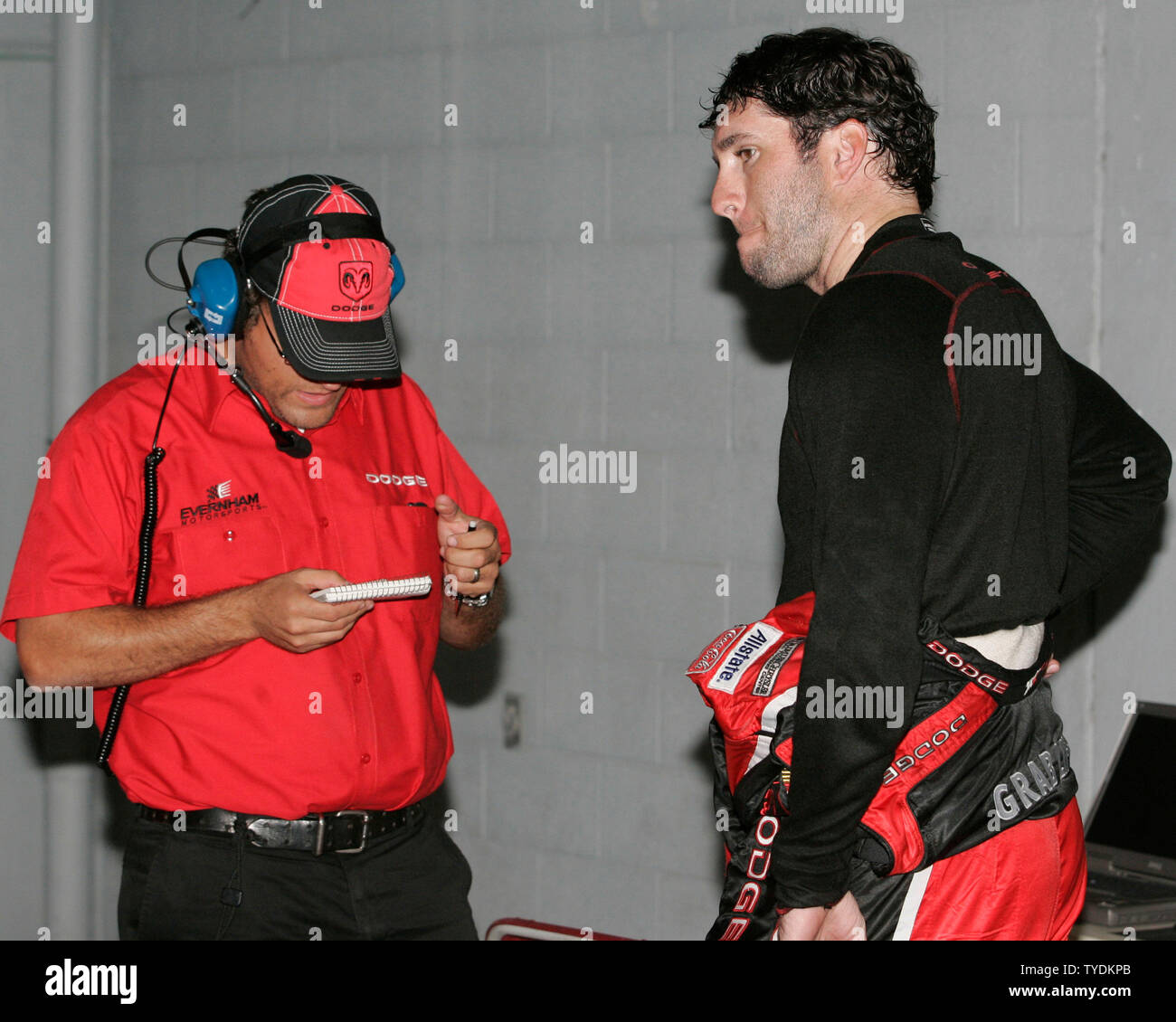 An unhappy Elliott Sadler(R) discusses his NASCAR Nextel Cup test session with a crew member, at Homestead Miami Speedway in Homestead, Florida on October 17, 2006.  (UPI Photo/Michael Bush) Stock Photo