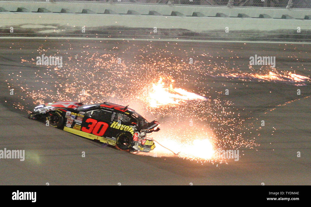 juan-pablo-montoya-hits-the-wall-in-turn-one-and-bursts-into-flames-during-the-running-of-the-nascar-nextel-cup-ford-400-at-homestead-miami-speedway-in-homestead-florida-on-november-19-2006-upi-photomalcolm-hope-TYDMAE.jpg