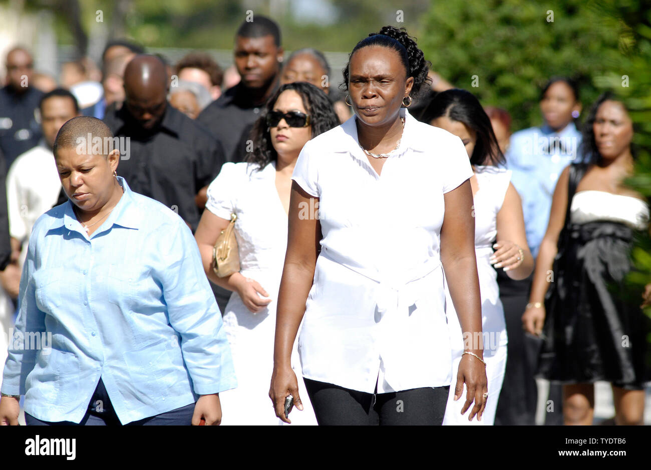 A funeral attendee wearing a Sean Taylor shirt waits in line to enter the  funeral service of Washington Redskins' safety Sean Taylor at the Pharmed  Arena on the campus of Florida International