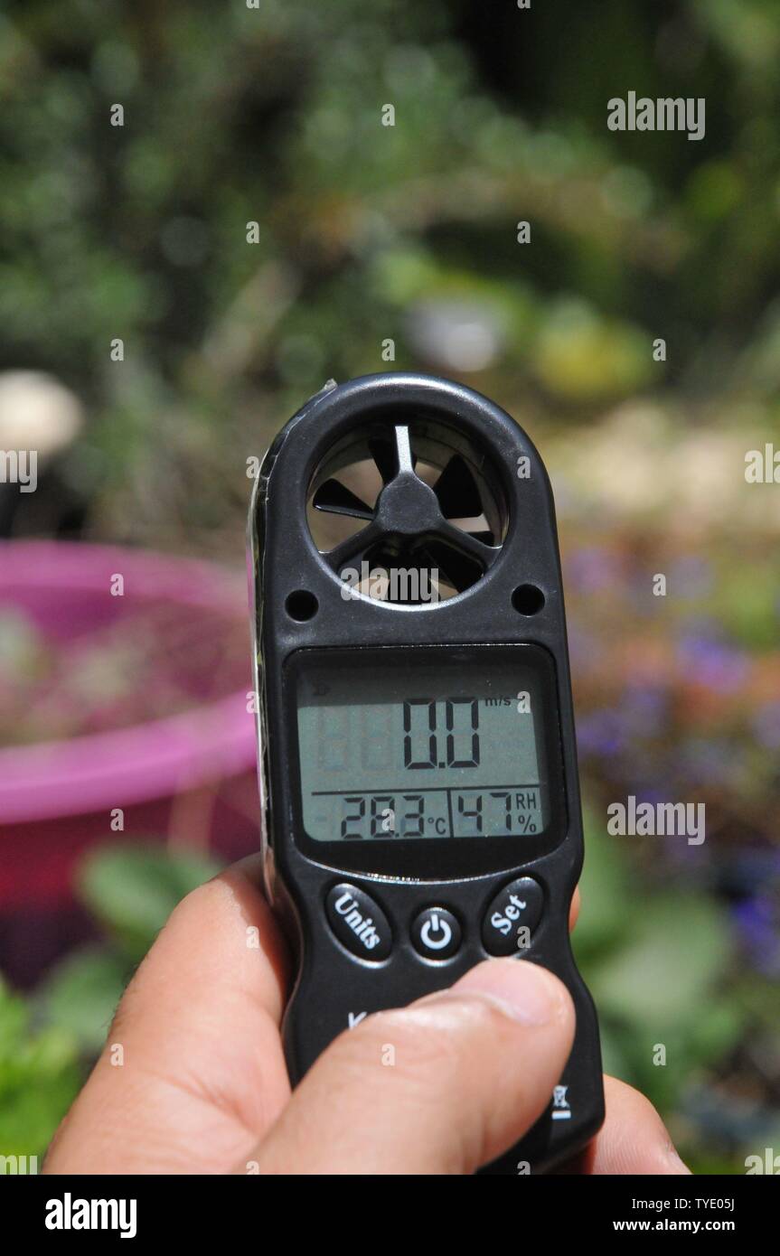 Hand held weather station Anemometer and thermometer Stock Photo Alamy