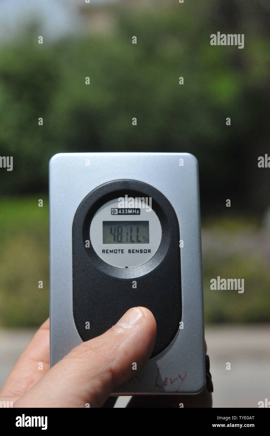 Hand held weather station Anemometer and thermometer Stock Photo