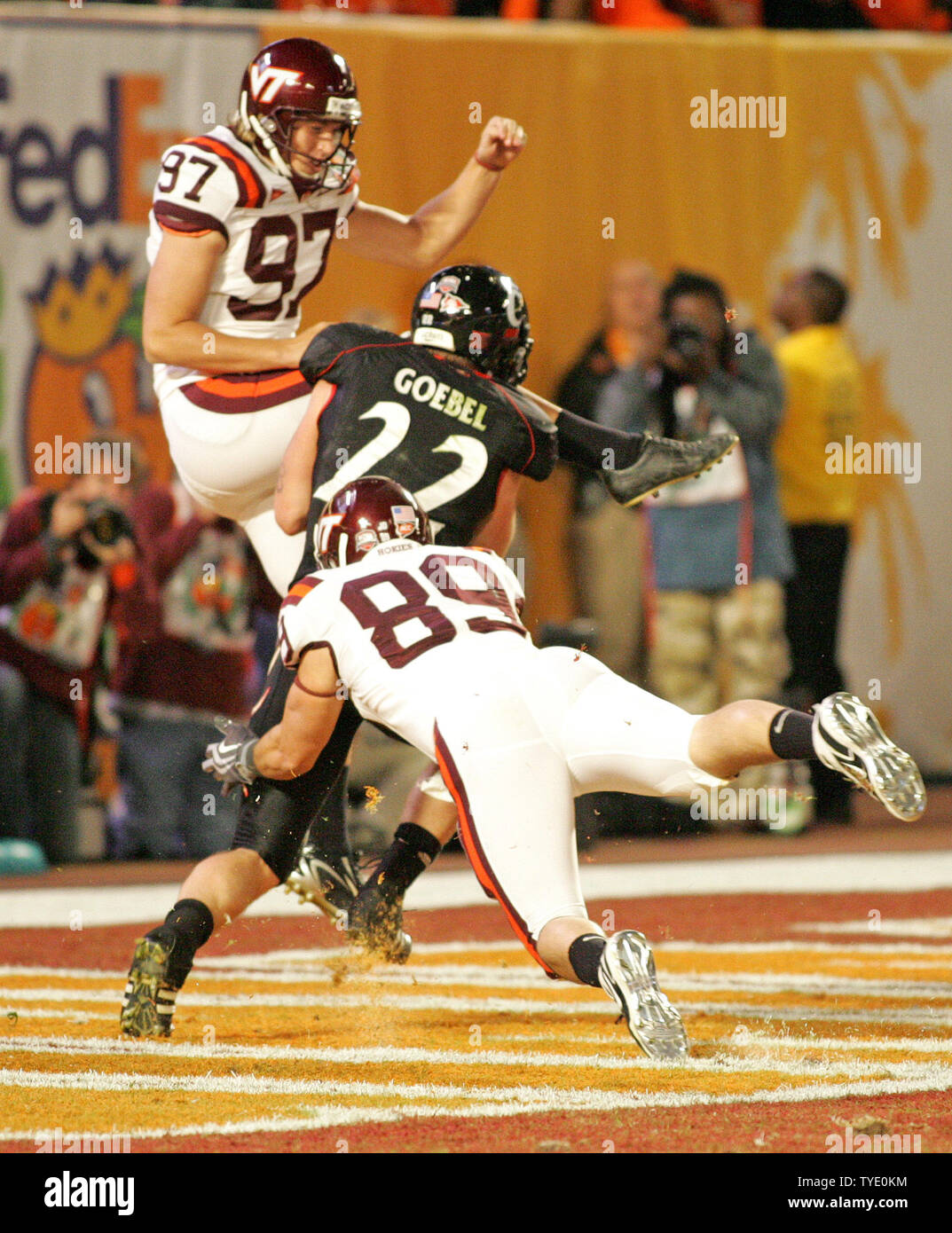 Cincinnati Bearcats' john Goebel (22) runs into Virginia Tech Hokies punter Brent Bowden (97) for a penalty in 4th quarter action at the 75th annual FedEx Orange Bowl game at Dolphin Stadium in Miami on January 1, 2009. (UPI Photo/Martin Fried) Stock Photo