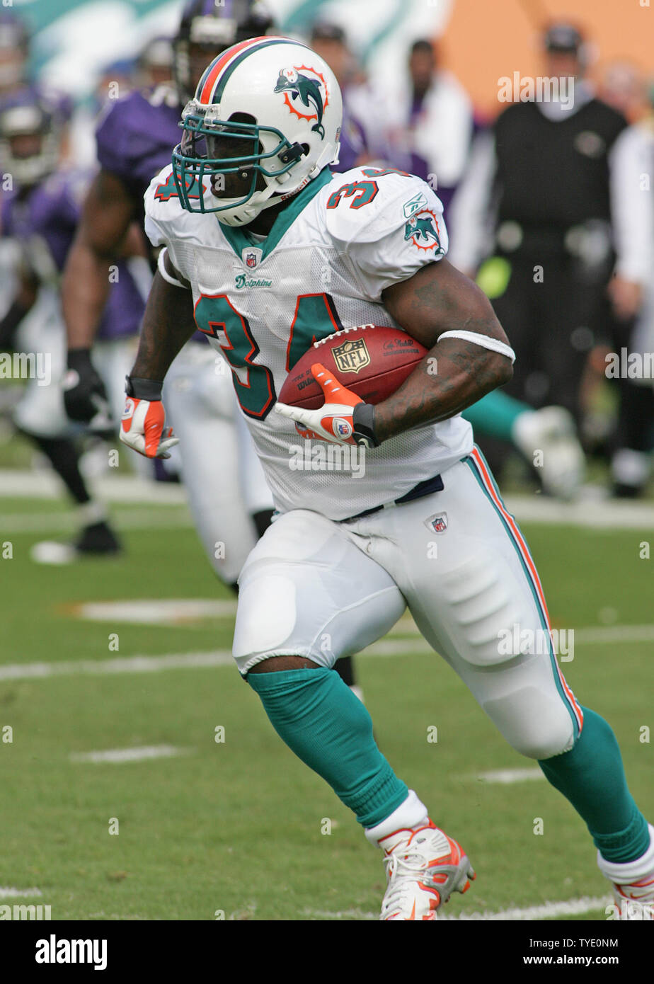 Miami Dolphins running back Ricky Williams (34) rushes for 7 yards in  second quarter action against the Baltimore Ravens in the NFL AFC wildcard  game at Dolphin Stadium in Miami on January