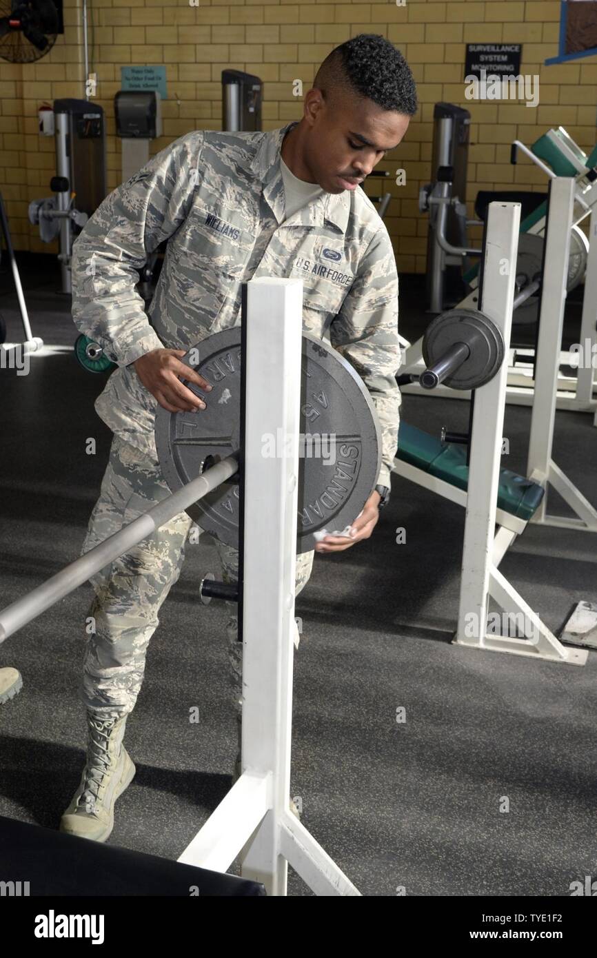 Airman 1st Class Terrell Williams, 75th Force Support Squadron, cleans workout equipment at the George E. Whalen Veterans Affairs Medical Center in Salt Lake City, Nov. 3. Hill Air Force Base Airmen teamed up with community partners for the Department of Defense’s annual ‘Commitment to Service’ project, an enterprise aimed at bettering communities across the nation. Stock Photo