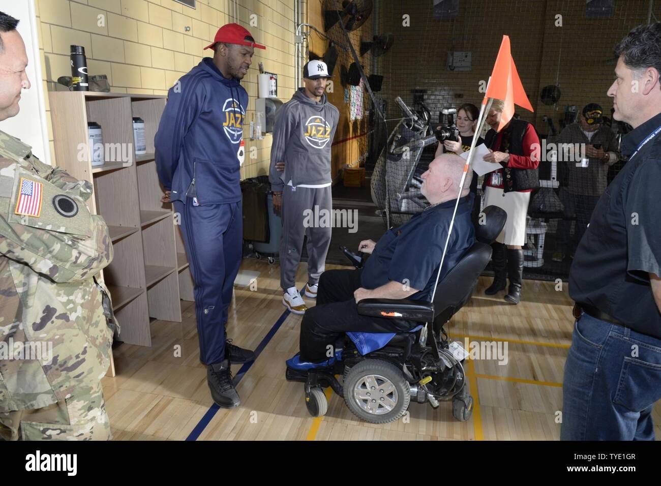 Utah Jazz players Derrick Favors and George Hill visit with a veteran at the newly remodeled gymnasium at the George E. Whalen Veterans Affairs Medical Center in Salt Lake City during the annual NBA/Department of Defemnse service project called ‘Commitment to Service,’ Thursday, Nov. 3, 2016. Stock Photo