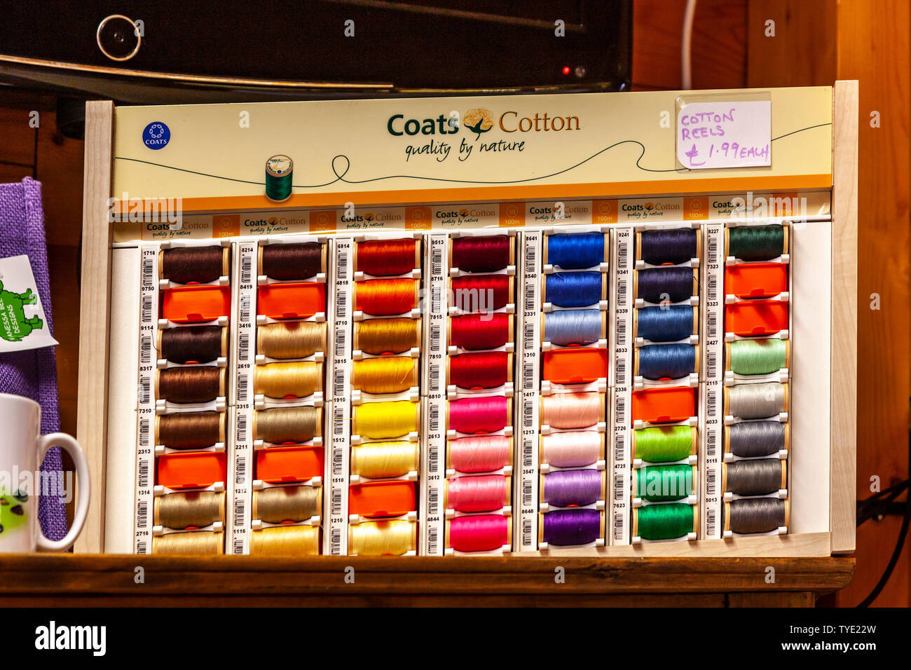 Display of different coloured needlework threads Stock Photo Alamy