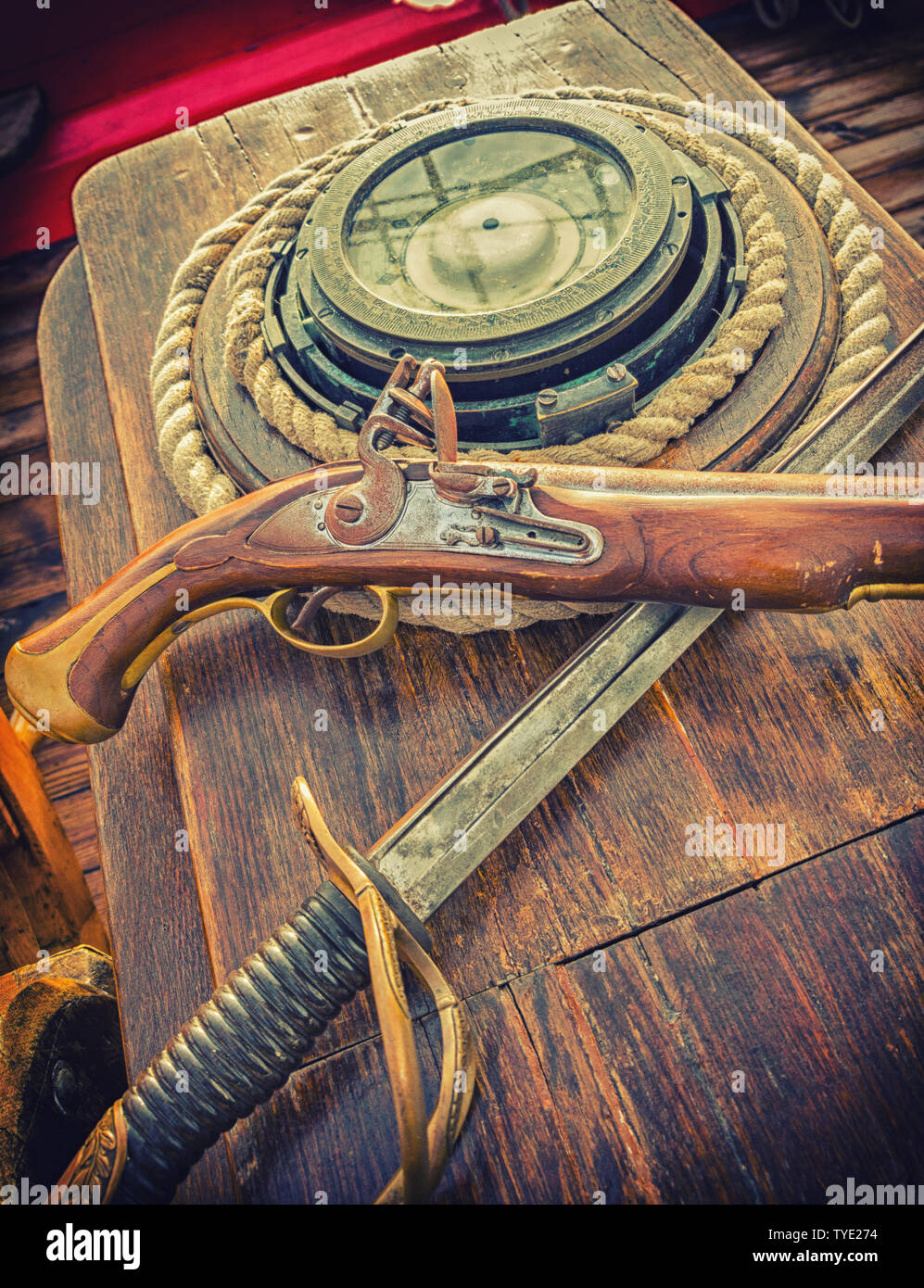 Pirate weapons on an old ship. Artistic photo toning Stock Photo - Alamy