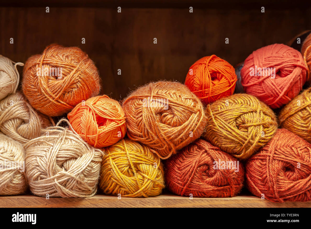 Display of different coloured knitting wools Stock Photo Alamy