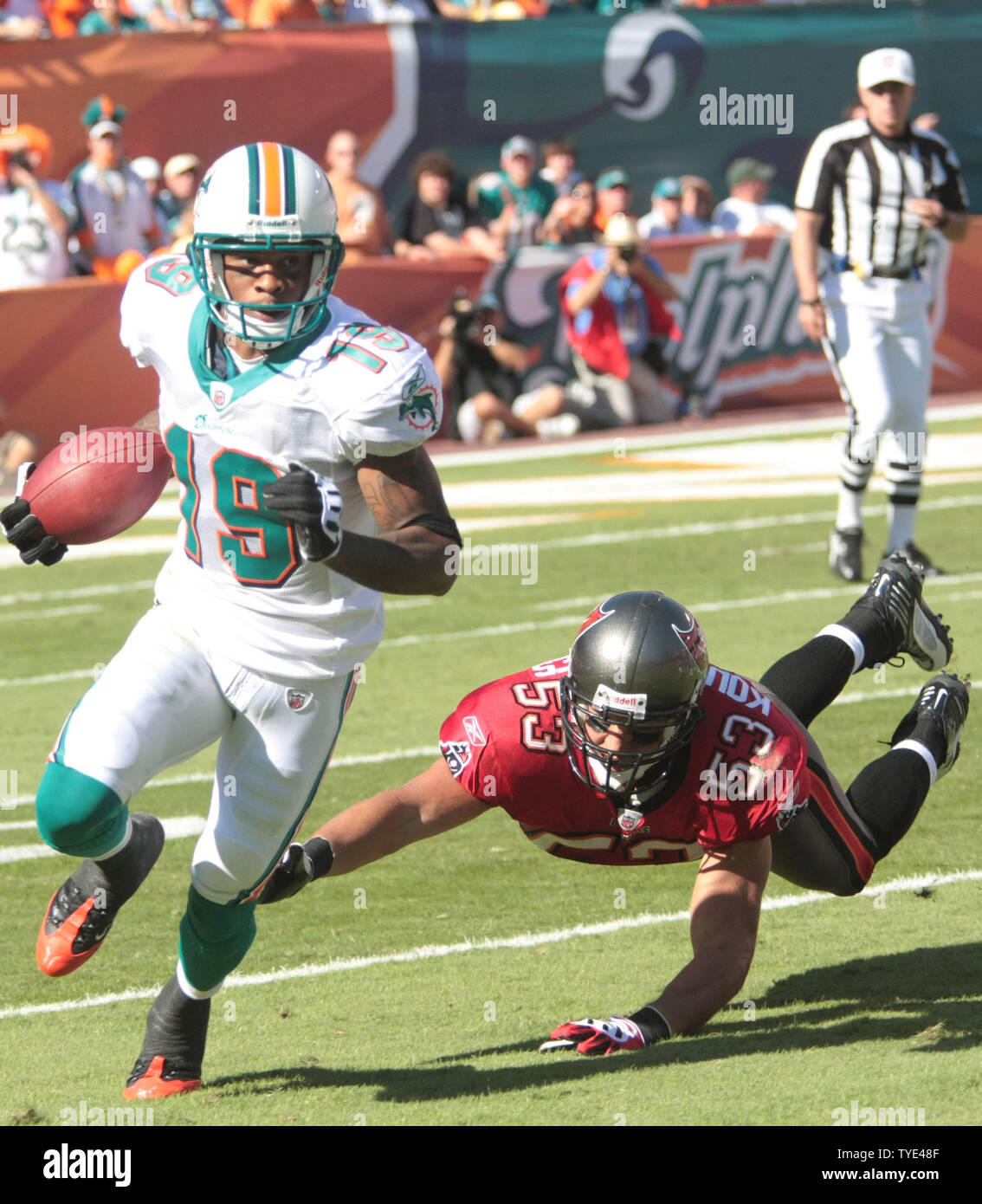 Miami Dolphins wide receiver Ted Ginn (19) runs back a punt vs