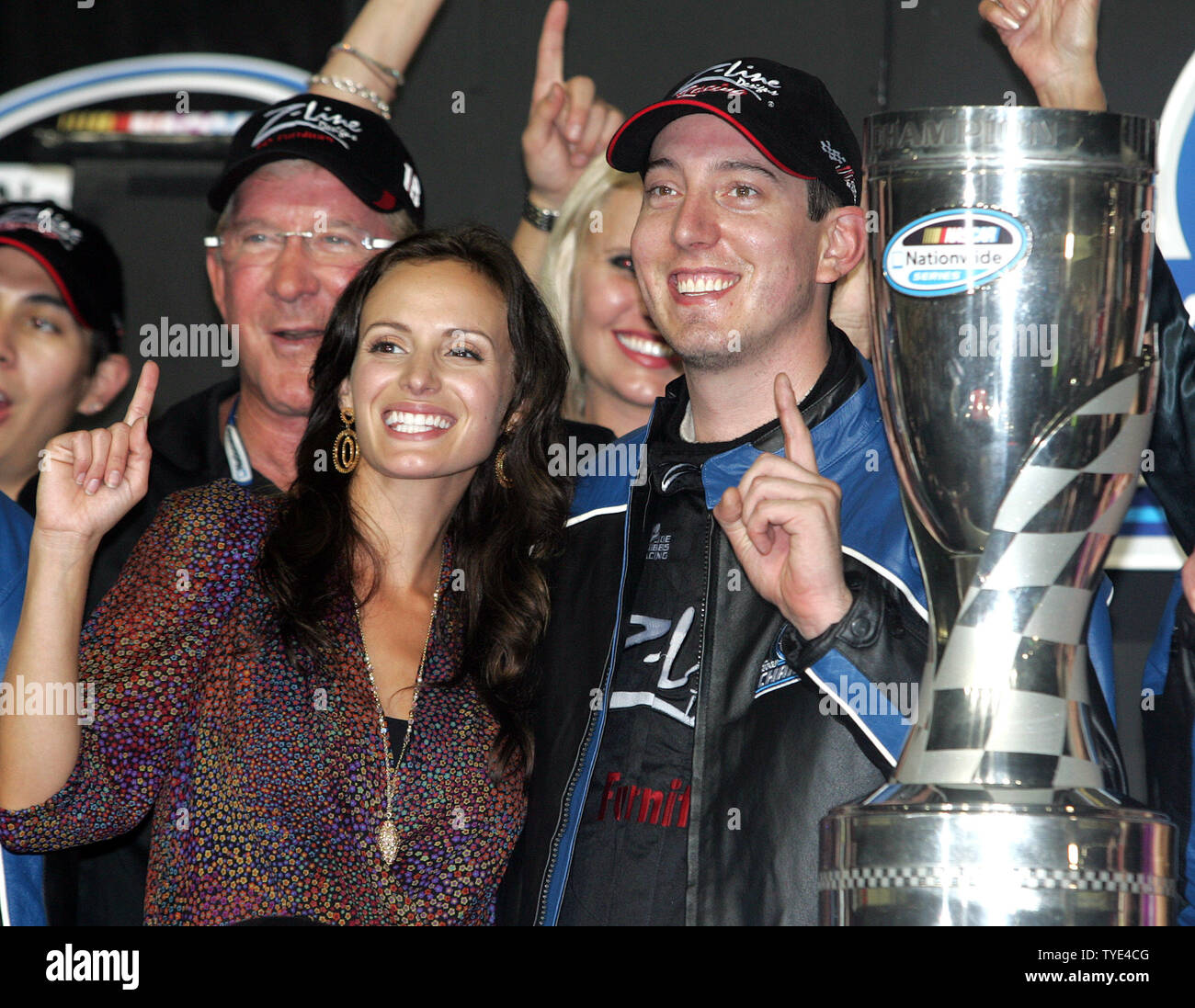 Kyle Busch and his girlfriend Samantha Sarcinella celebrate winning the