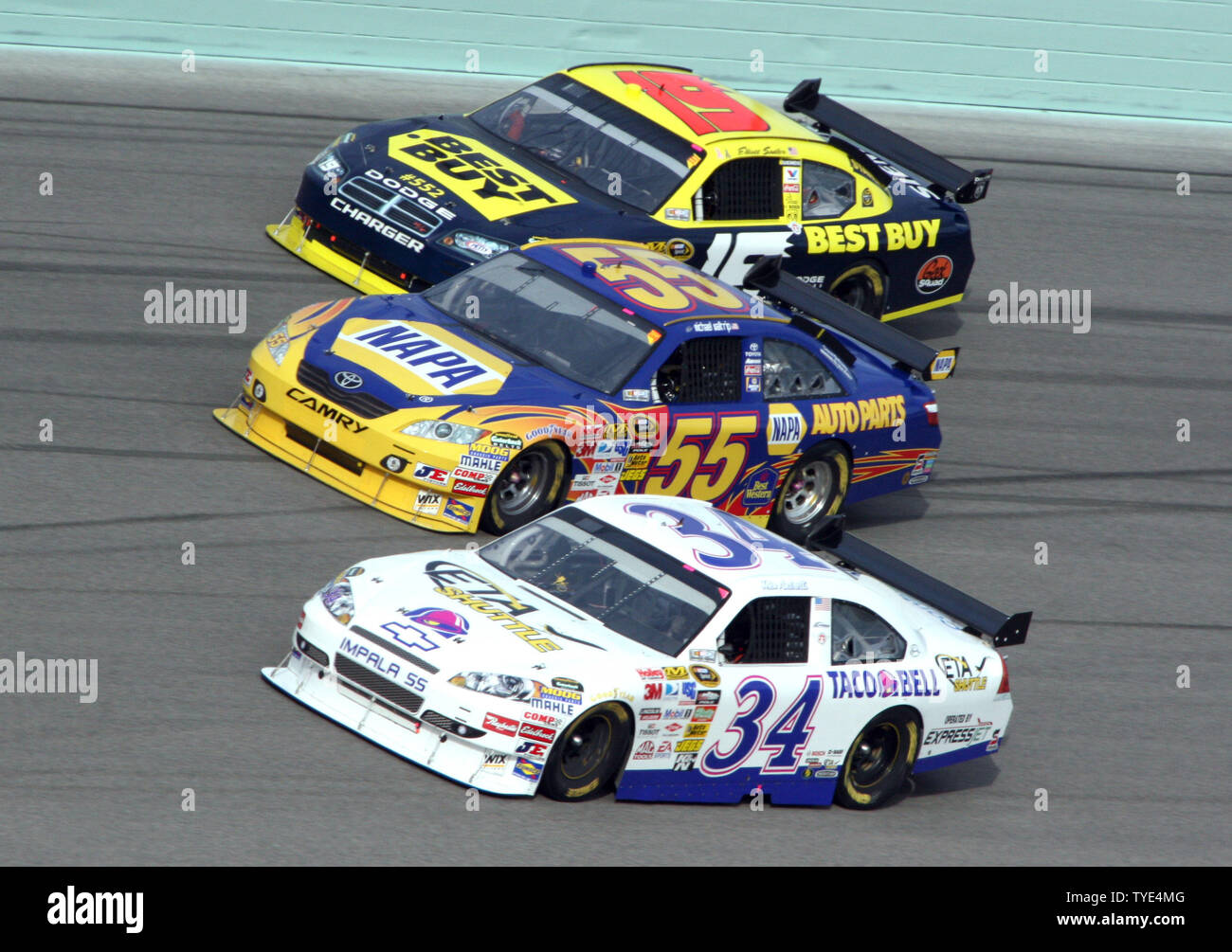 Elliott Sadler (19), Michael Waltrip (55) and John Andretti (34) run three wide through turn four during the Sprint Cup Ford 400 at Homestead-Miami Speedway in Homestead, Florida on November 22, 2009.  UPI/Chad Cameron Stock Photo