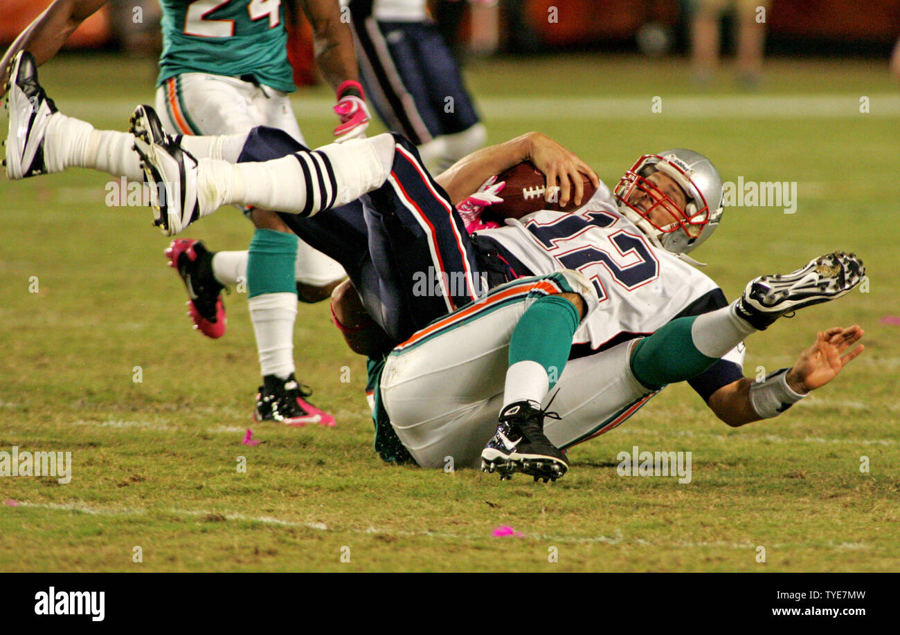 New England Patriots quarterback Tom Brady is sacked for a loss by