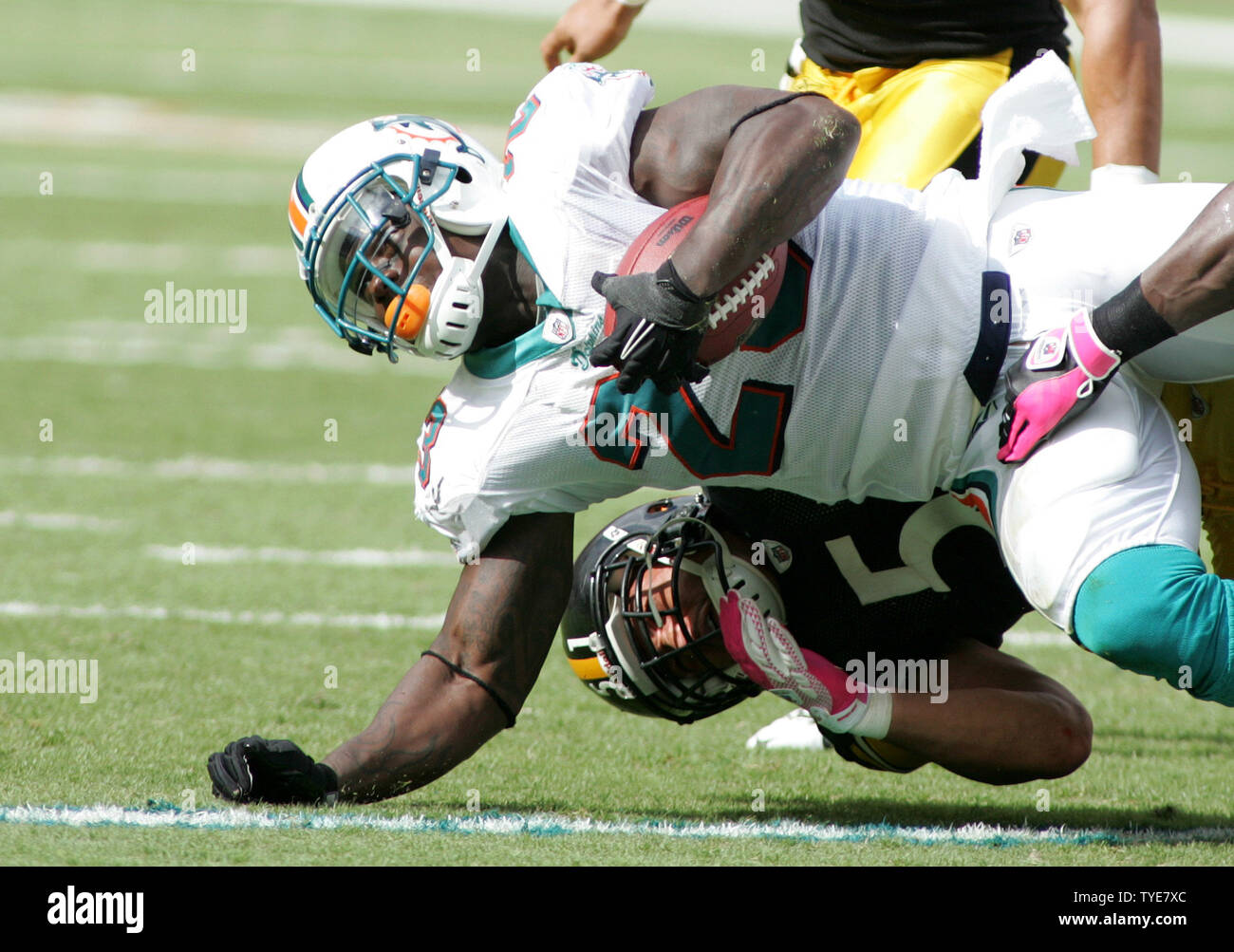 Miami, Fla, USA. 23rd Oct, 2011. Miami Dolphins running back Reggie Bush  (22) runs upfield during the Dolphins 18-15 overtime loss to the Denver  Broncos at Sun Life Stadium on Oct. 23