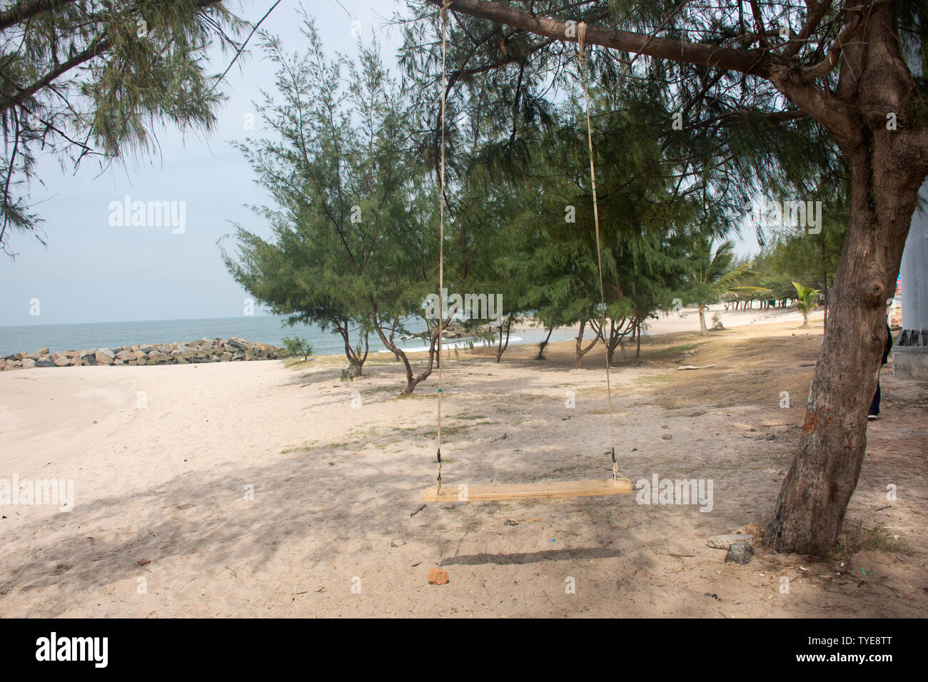 Wind And Wave With Wooden Bench Swings Toy At Morning Time At Ban